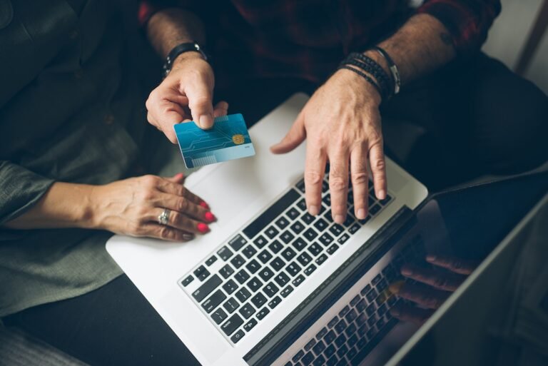 Senior couple checking their finances on a laptop at home