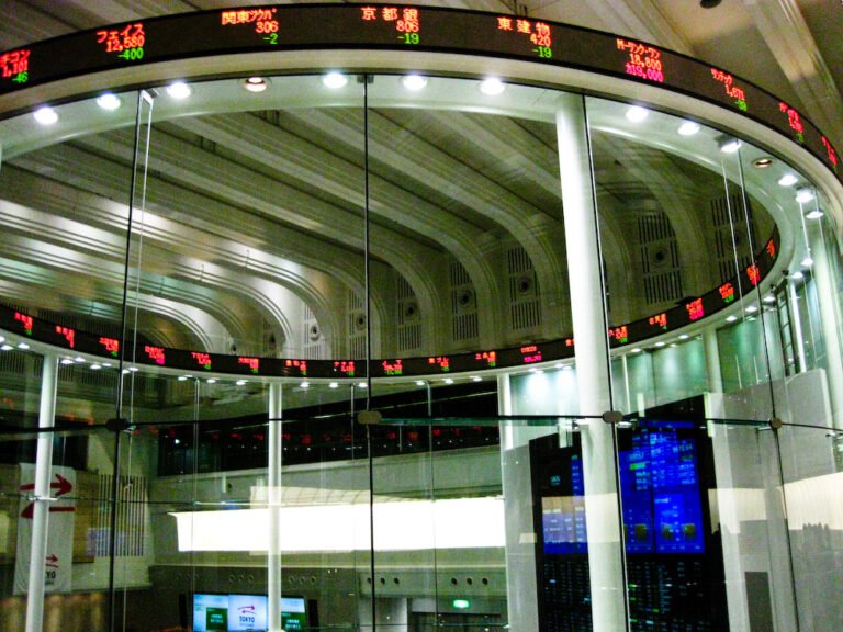 Bond Markets Bet on Rate Cuts, but Central Bankers Urge Patience Trading screens showing financial market data in an office